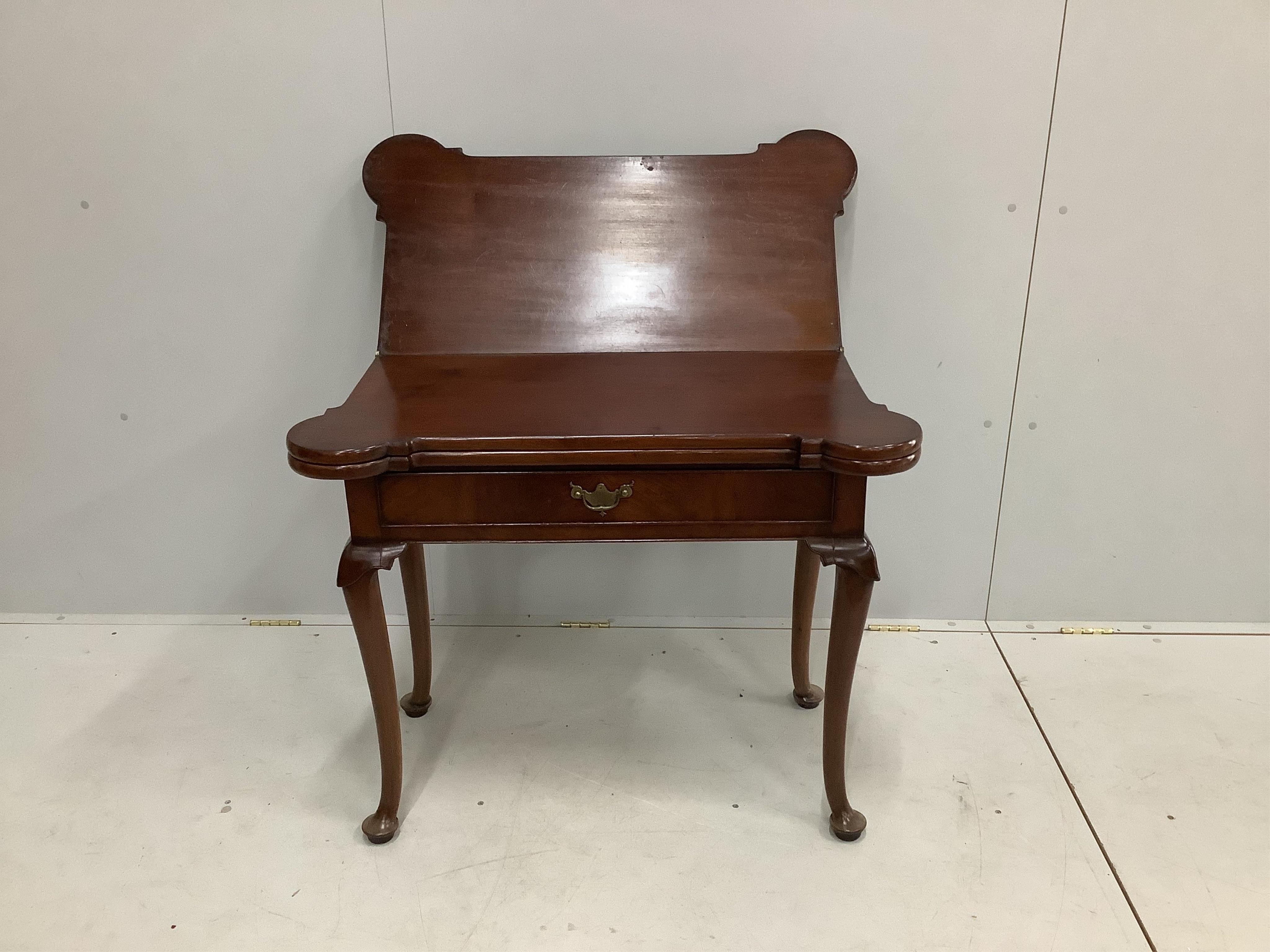 An 18th century mahogany double folding tea / card table, width 90cm, depth 45cm, height 74cm. Condition - fair